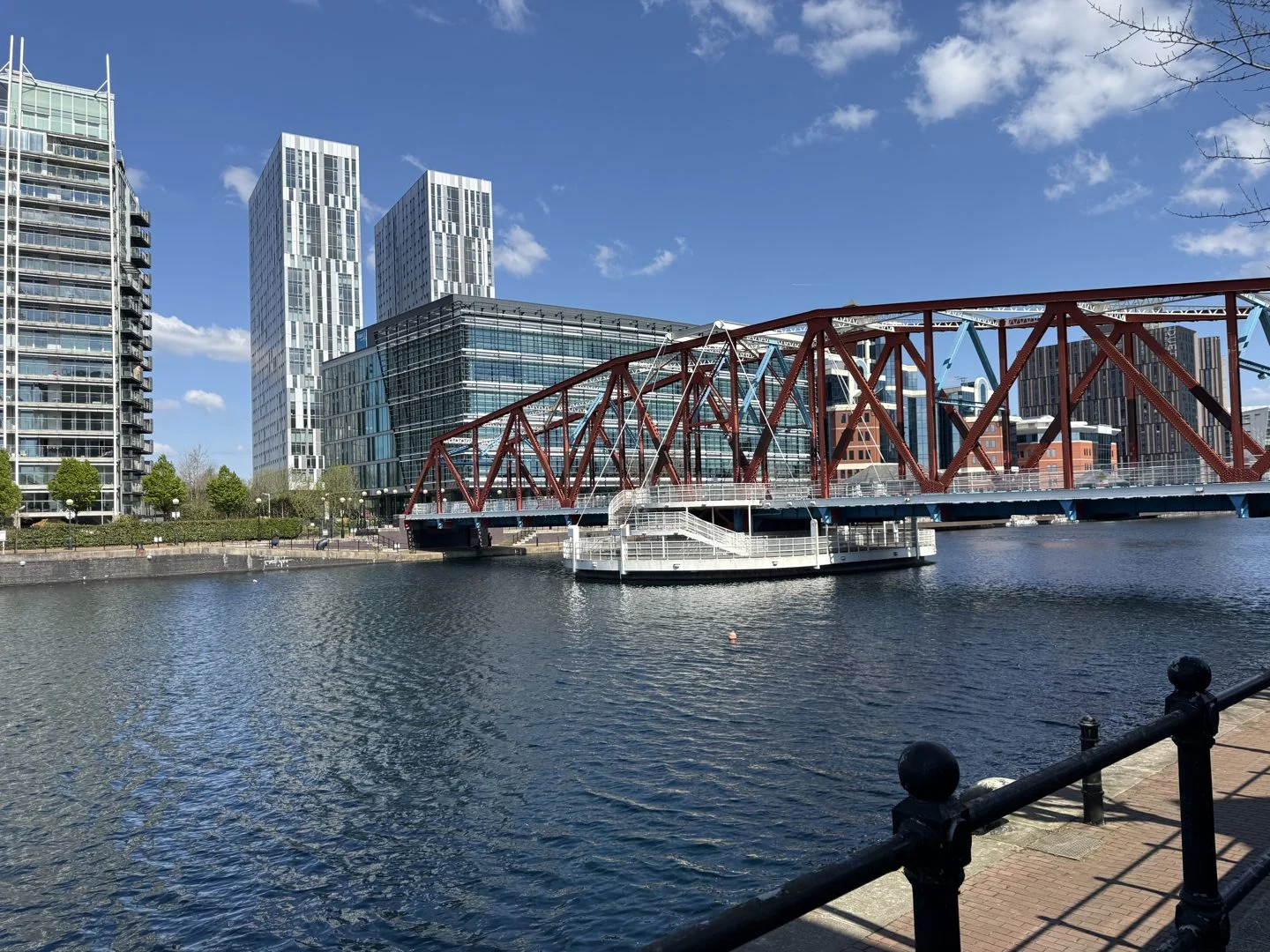 Salford Quays swing bridge with Manchester skyline